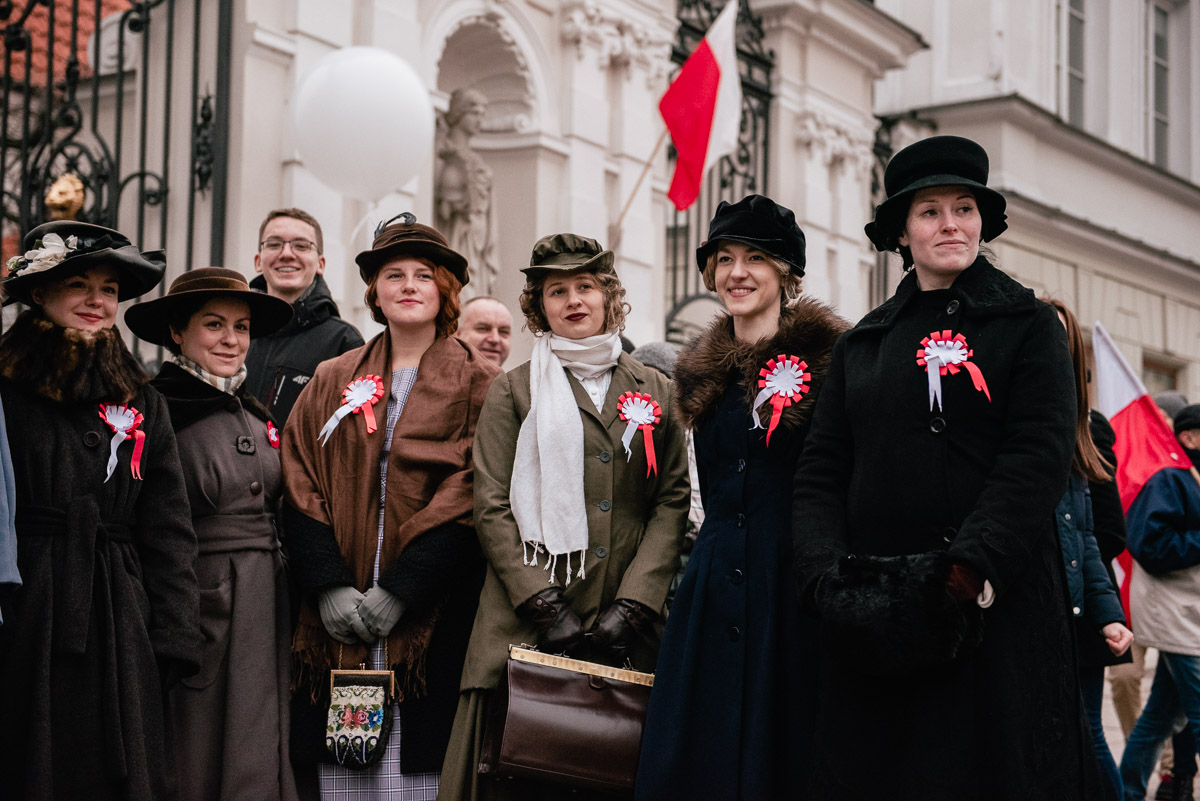 A photograph showing several smiling women in early 20th century clothes