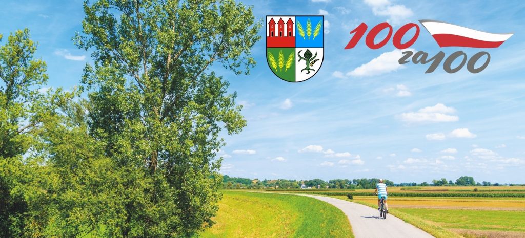 Baner ze zdjęciem mężczyzny jadącego na rowesze po drodze przez łąkę, w górze herb Przasnysza i logo projektu